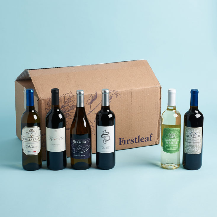 firstleaft wine box with wine bottles around it on a blue background