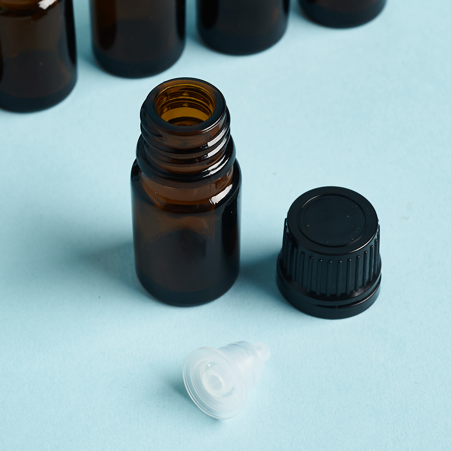 Close-up of Simply Earth dropper bottle for essential oils.