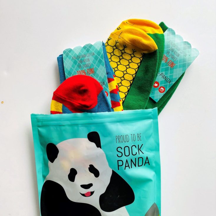 sock panda subscription bag with socks spilling out