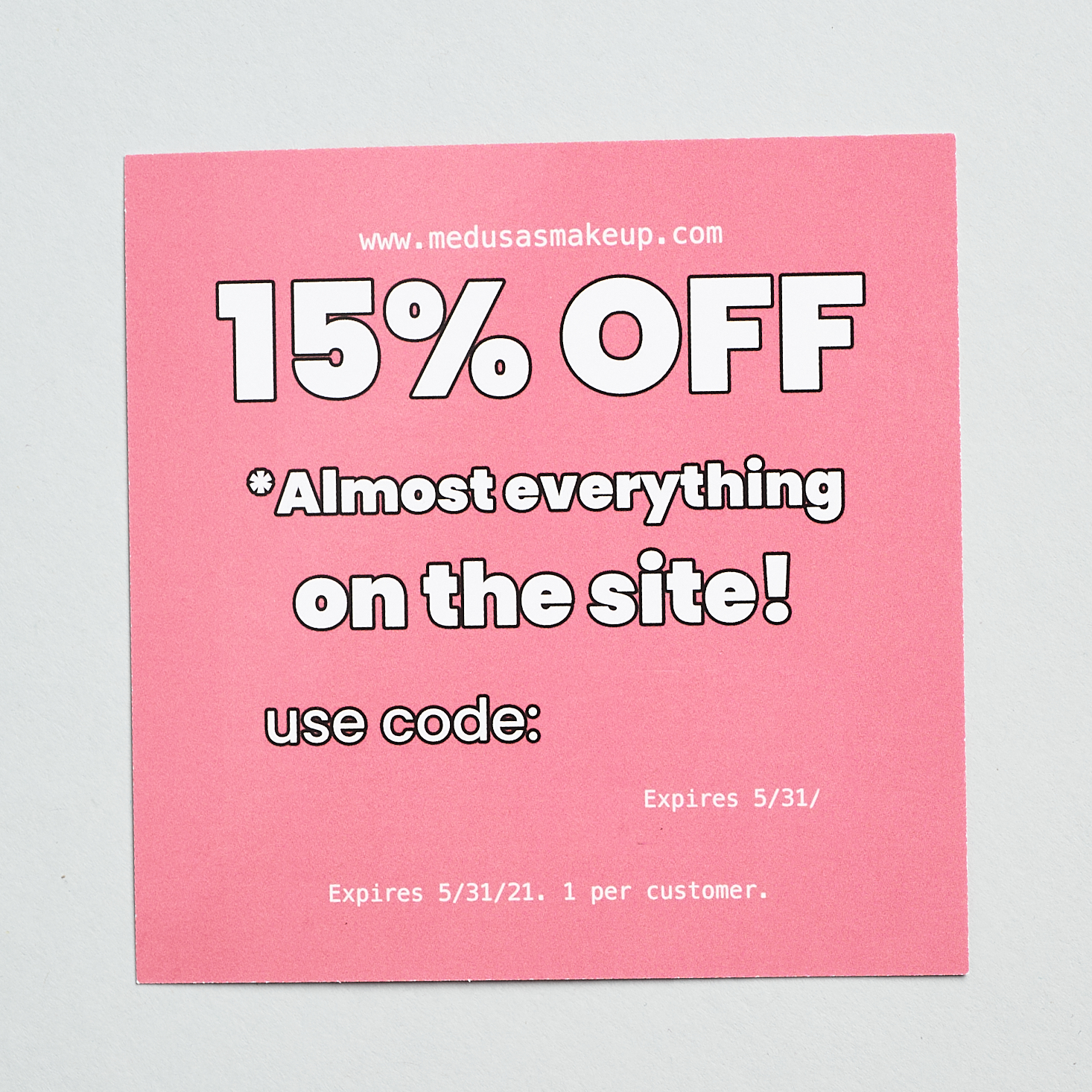 pink coupon code cord with white words