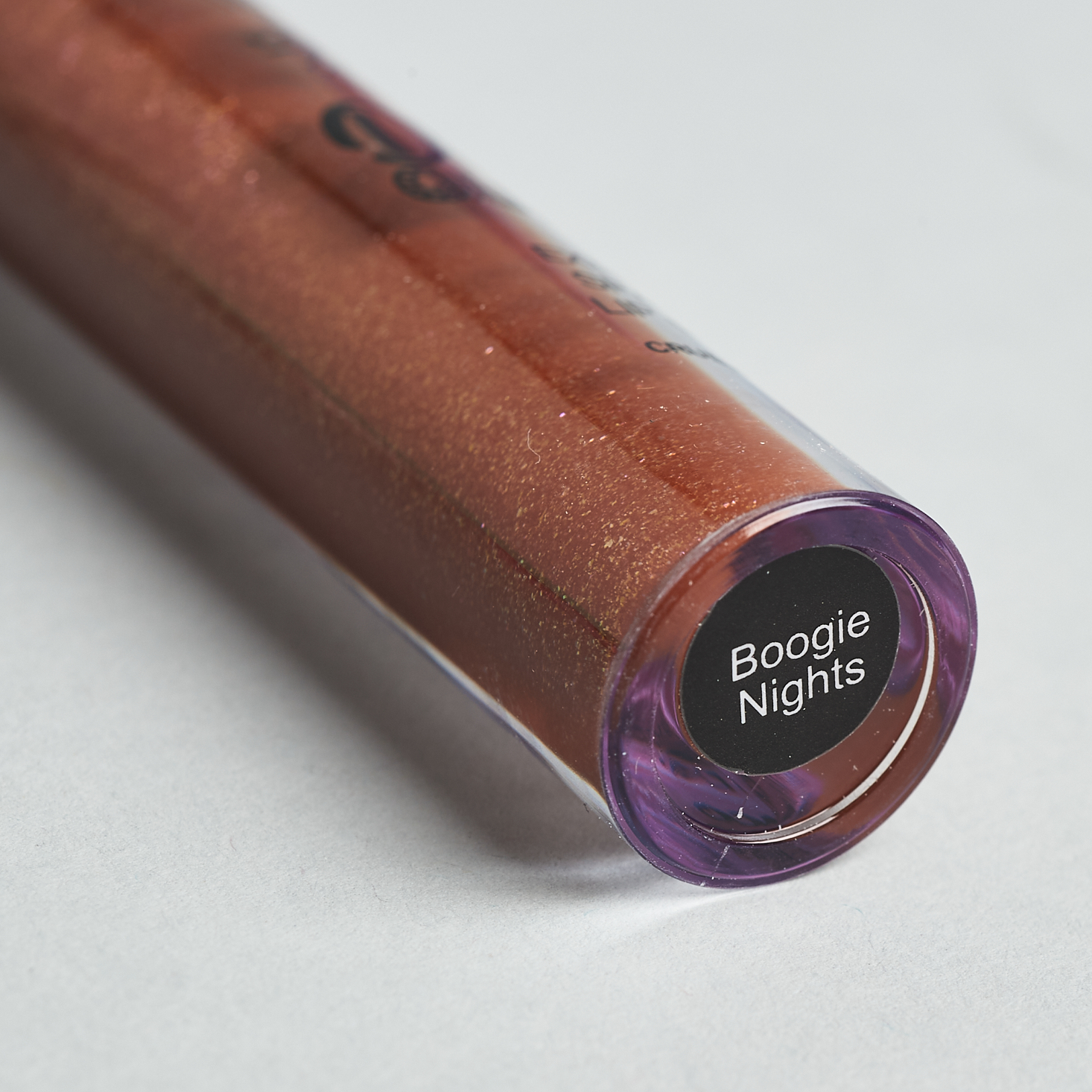 Bottom of lipgloss. Label says name of gloss- boogie nights.