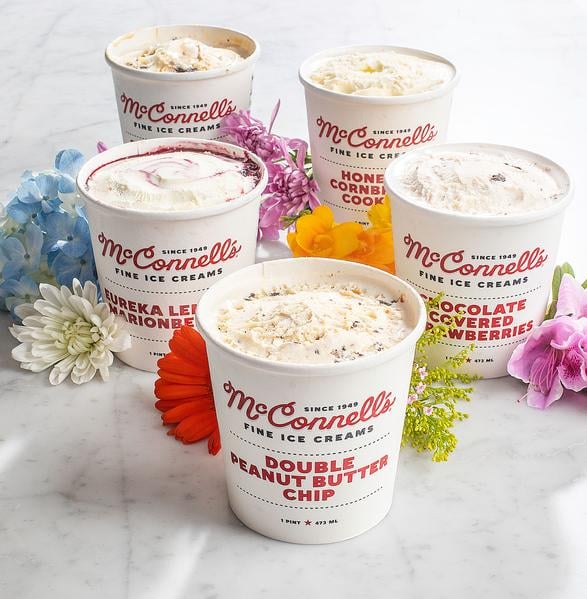 McConnells ice cream cups with no lids surrounded by flowers