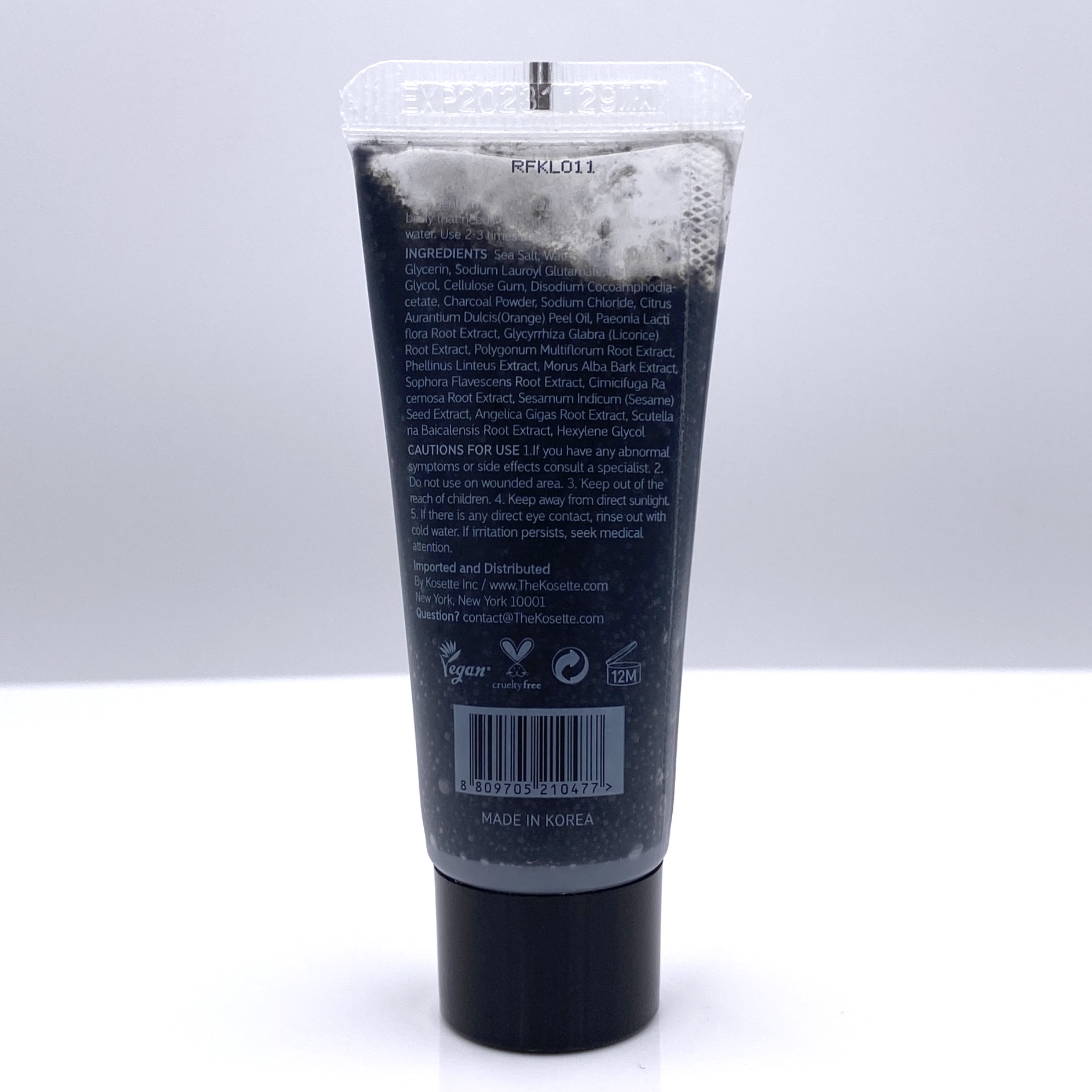 Sample-sized Kosette Salt Body Scrub, showing the back of the tube.