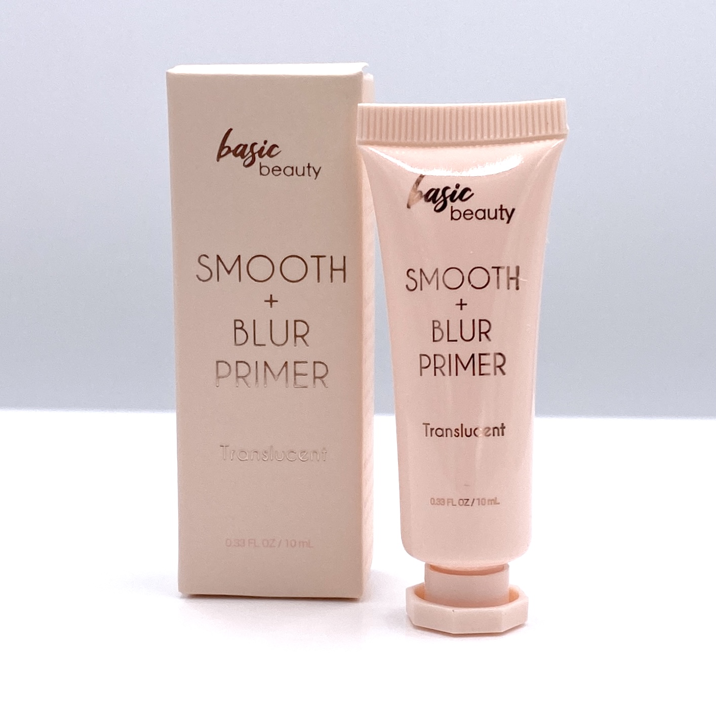The front of the box and bottle for Basic Beauty Translucent Primer from the Ipsy Glam Bag May 2021.