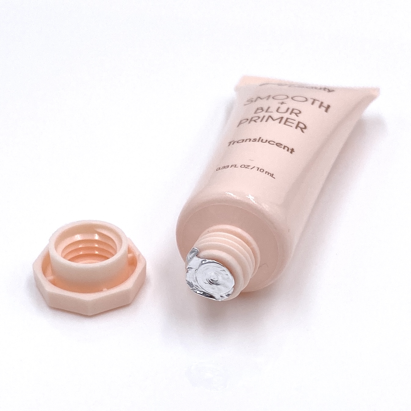 The open bottle for the Basic Beauty Translucent Primer from the Ipsy Glam Bag May 2021.