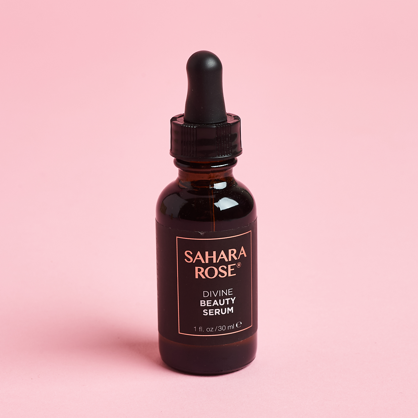 The front of the bottle for Sahara Rose Divine Beauty Serum from the Nourish Beauty Box June 2021.