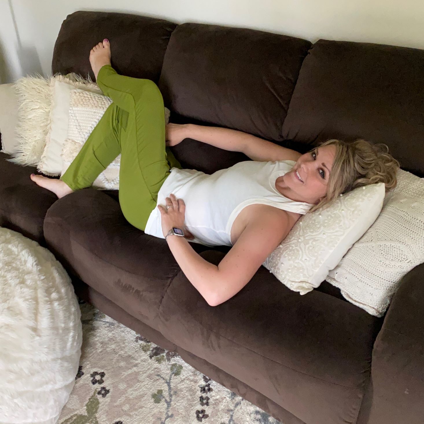 Modeled Fabletics laying down Fabletics May 2020 Box