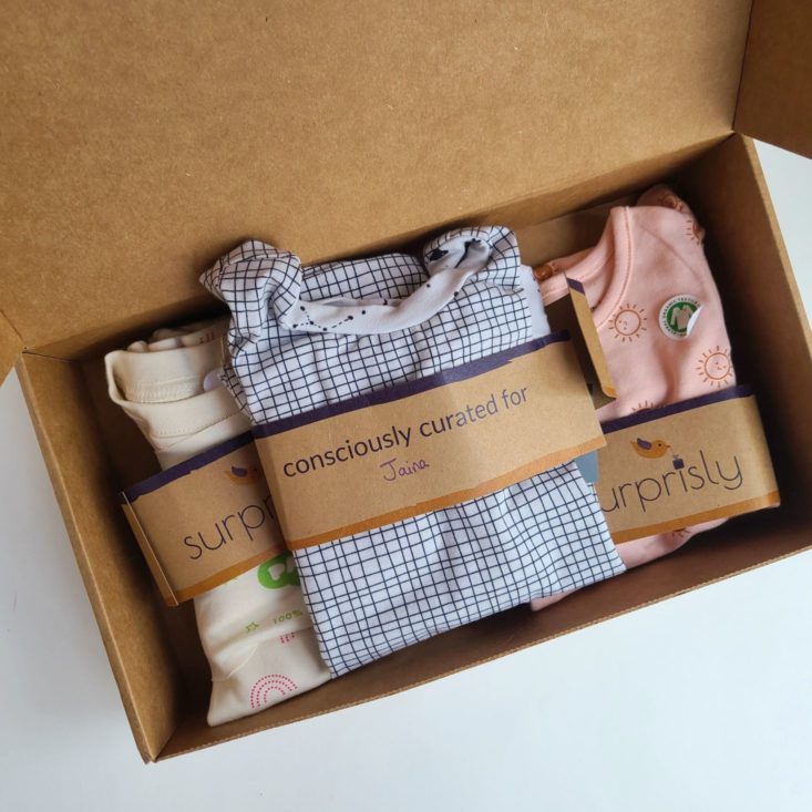 Suprisly May 2021 three outfits folded in shipping packaging