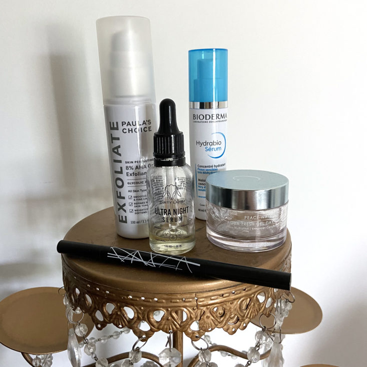 used containers of skincare and makeup products