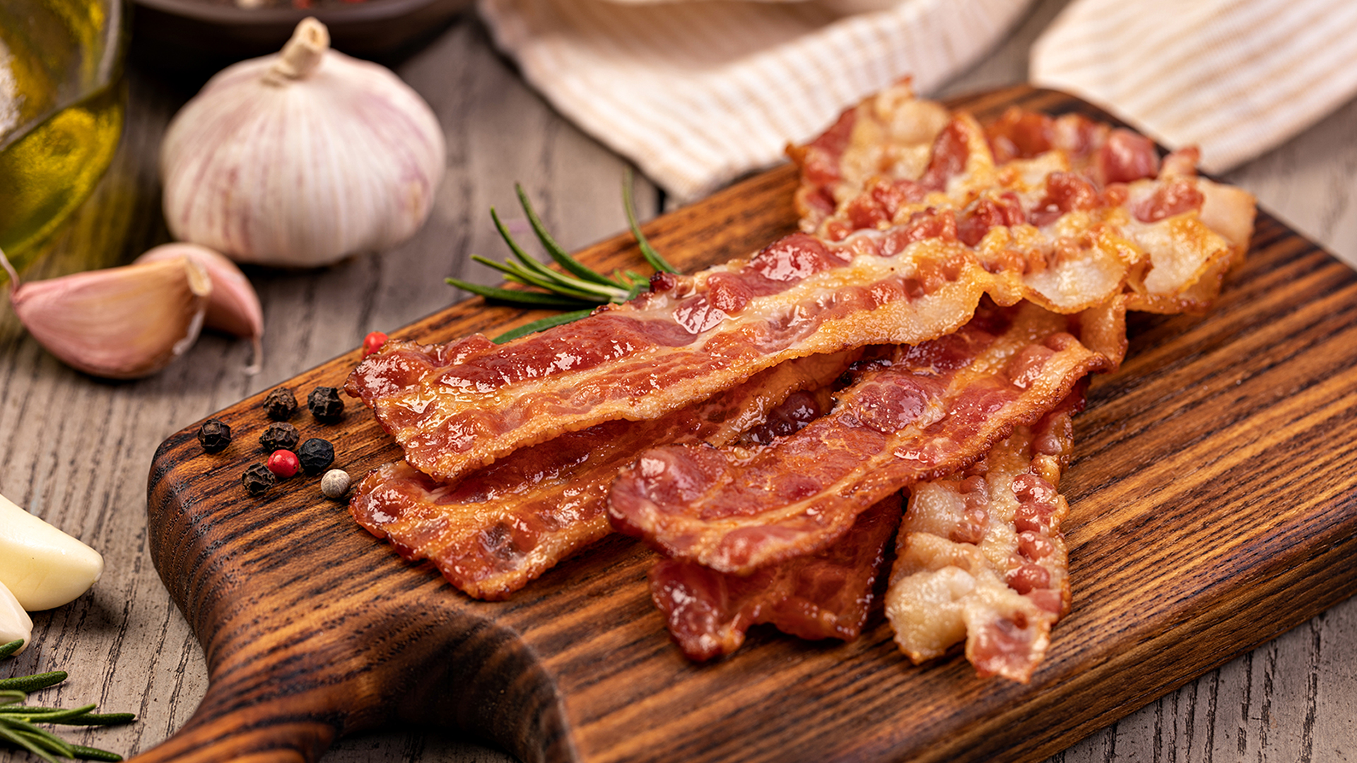 Closeup of slices of crispy hot fried bacon