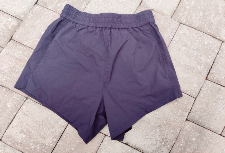 back side of Universal Standard sunny swim shorts in black