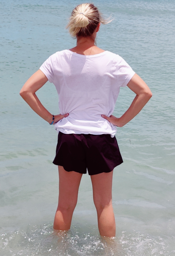 Universal Standard sunny swim shorts being worn from behind