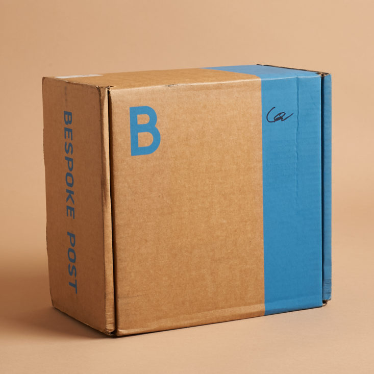 brown box with blue stripe and letter B in blue