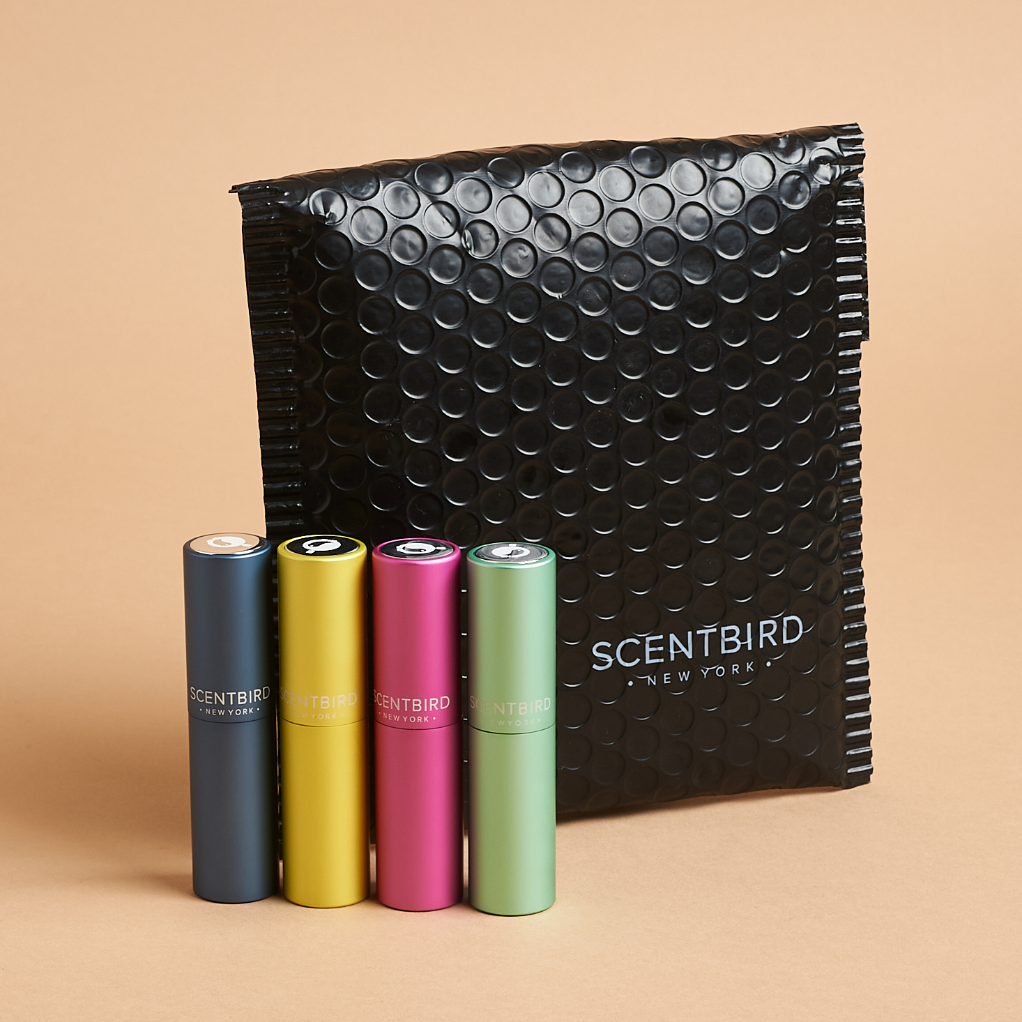 Black Scentbird bubble mailer with four different fragrance cases