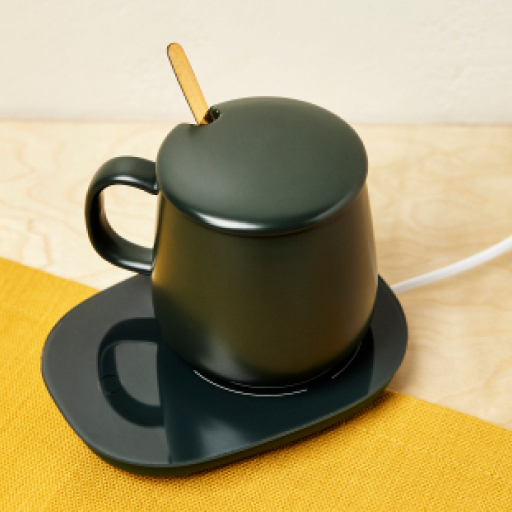 Black smart mug with a lid and stirring stick sticking out