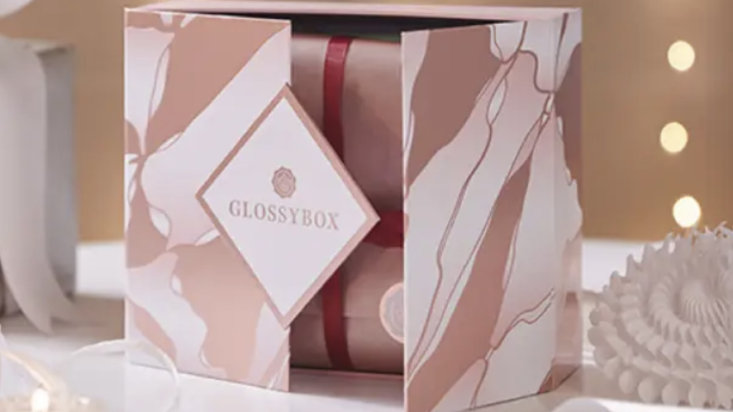 glossybox advent calendar box opening on white table