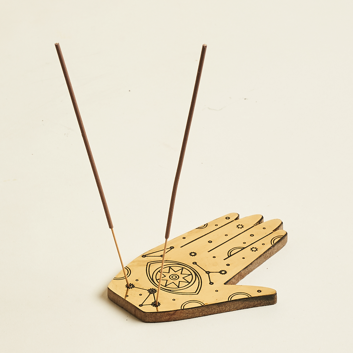 two incense sticks in holder