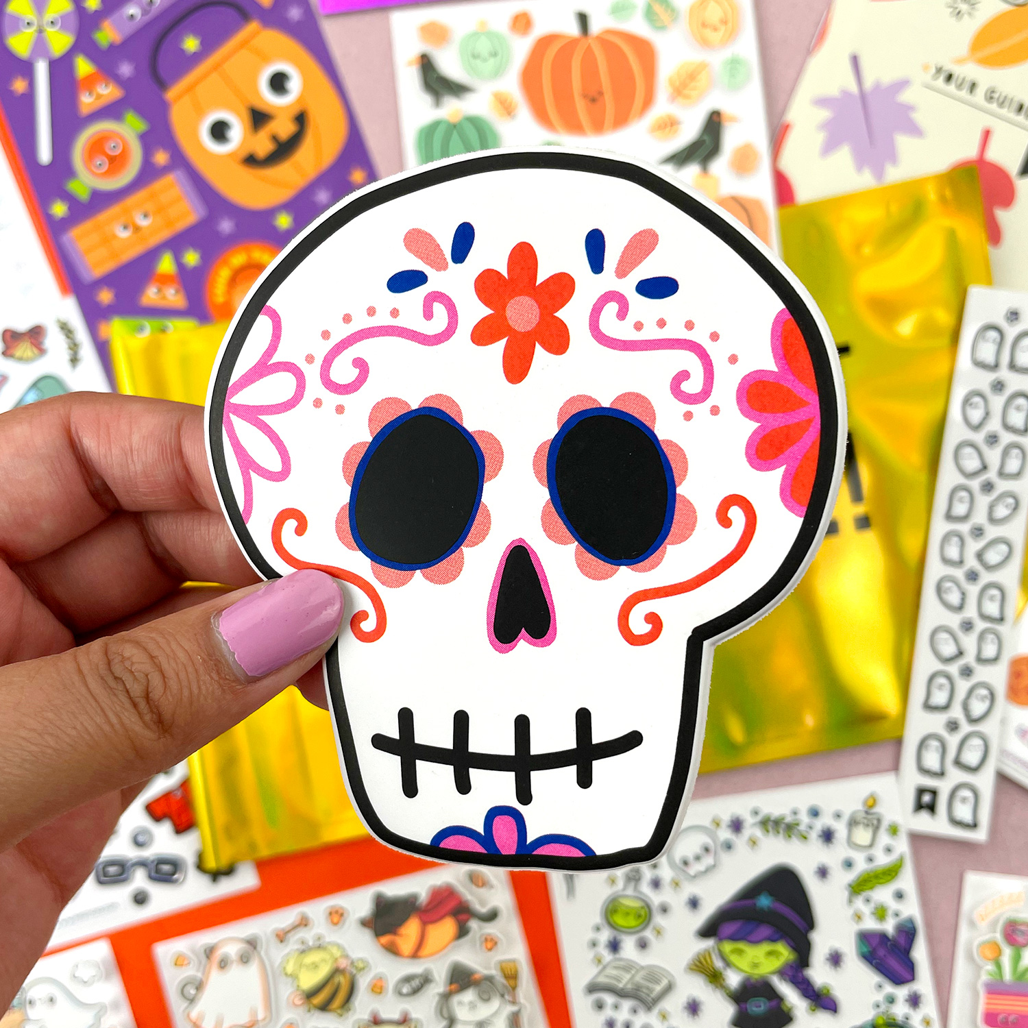 photo of cute skull sticker; other kids stickers are in the background