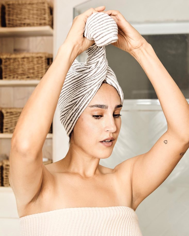 Photo of woman wrapping her hair inside the Bemakai Manta Hair Towel Wrap