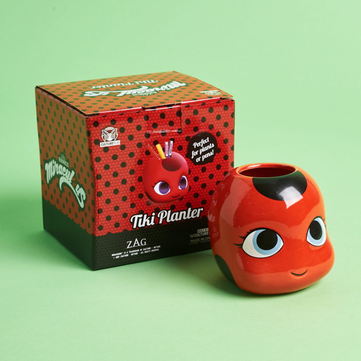 miraculous box with stuffed ladybug beside it