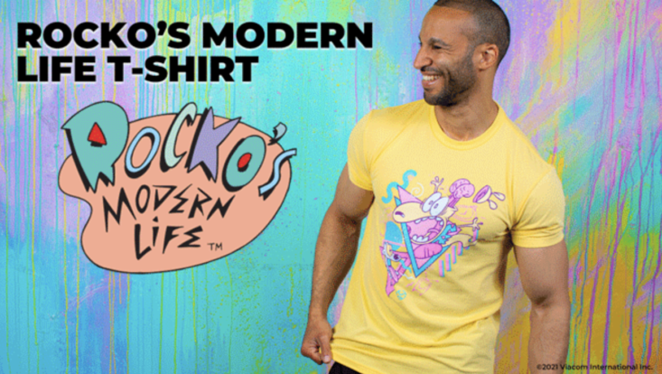 man wearing yellow t-shirt with rocko's modern world design