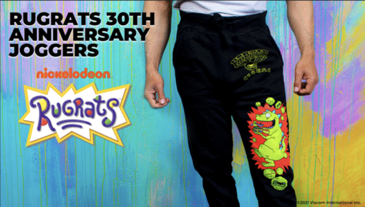 person wearing black sweatpants featuring reptar from the rugrats