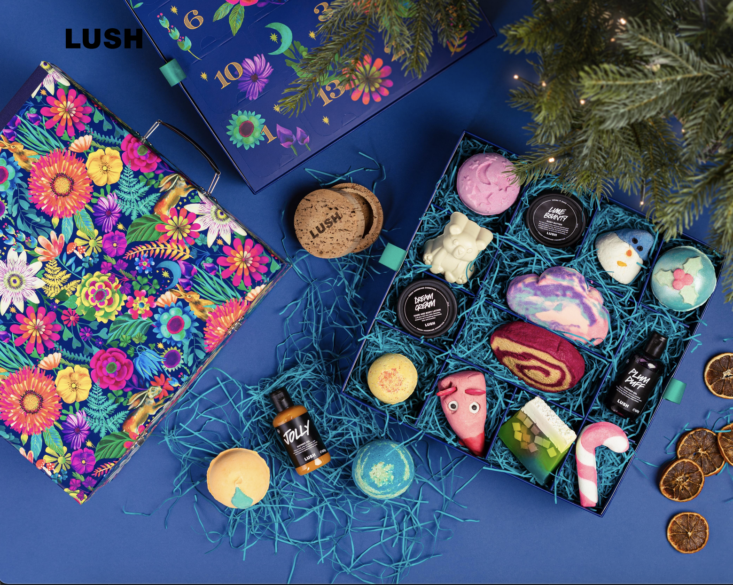 lush advent calendar and accessories on a blue background