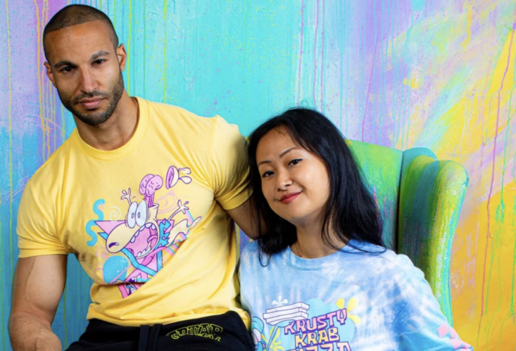 woman and man sitting next to each other wearing nickelodeon t-shirts