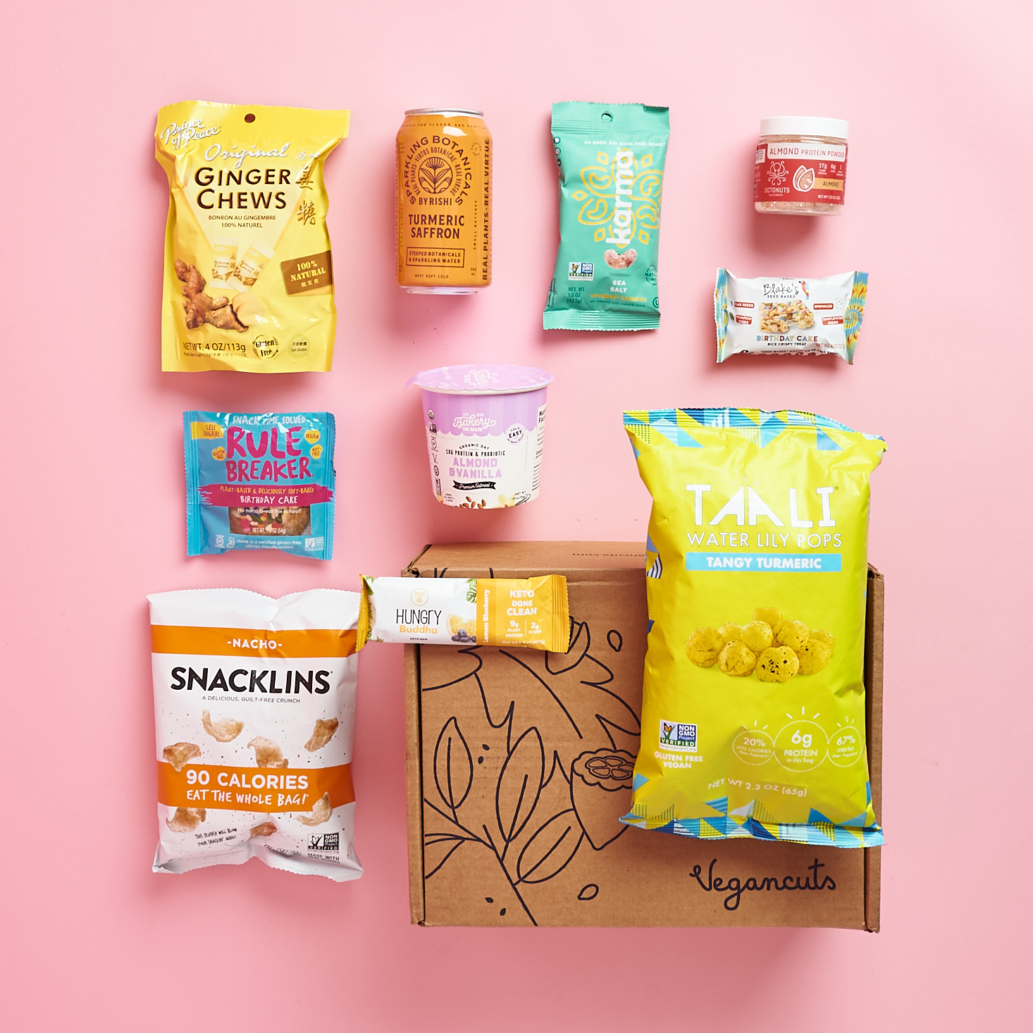 vegancuts cardboard box with vegan snacks around it