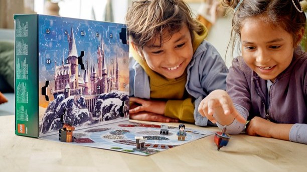 Photo of two kids playing with LEGO Harry Potter set