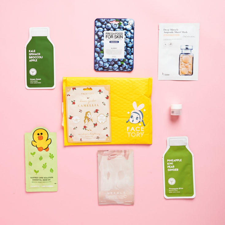 sheet masks surrounding the yellow bubble mailer