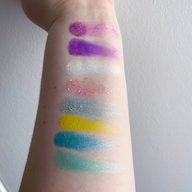 arm swatch of shimmery and glittery rainbow eyeshadow colors 