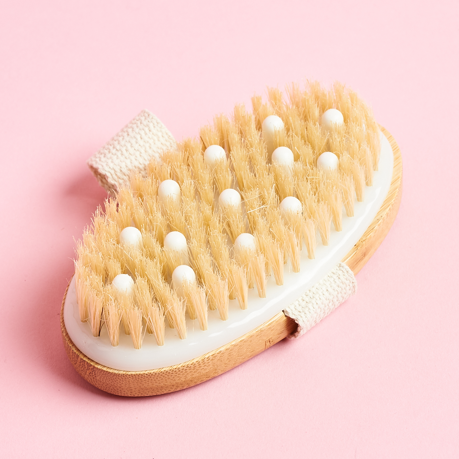 dry body brush showing bristles and rubber nubs