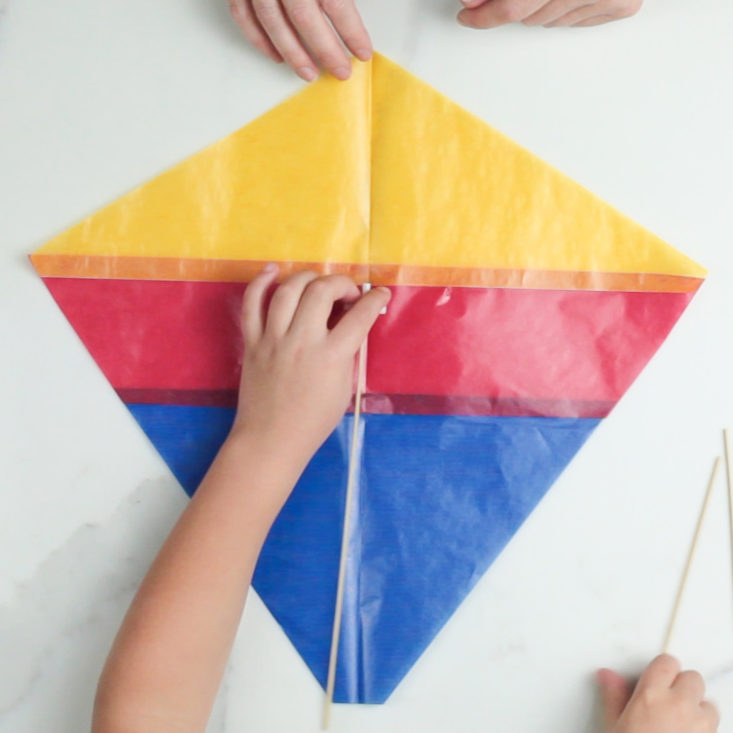 Days United kite kit for Lohri celebration with child's hands making the kite