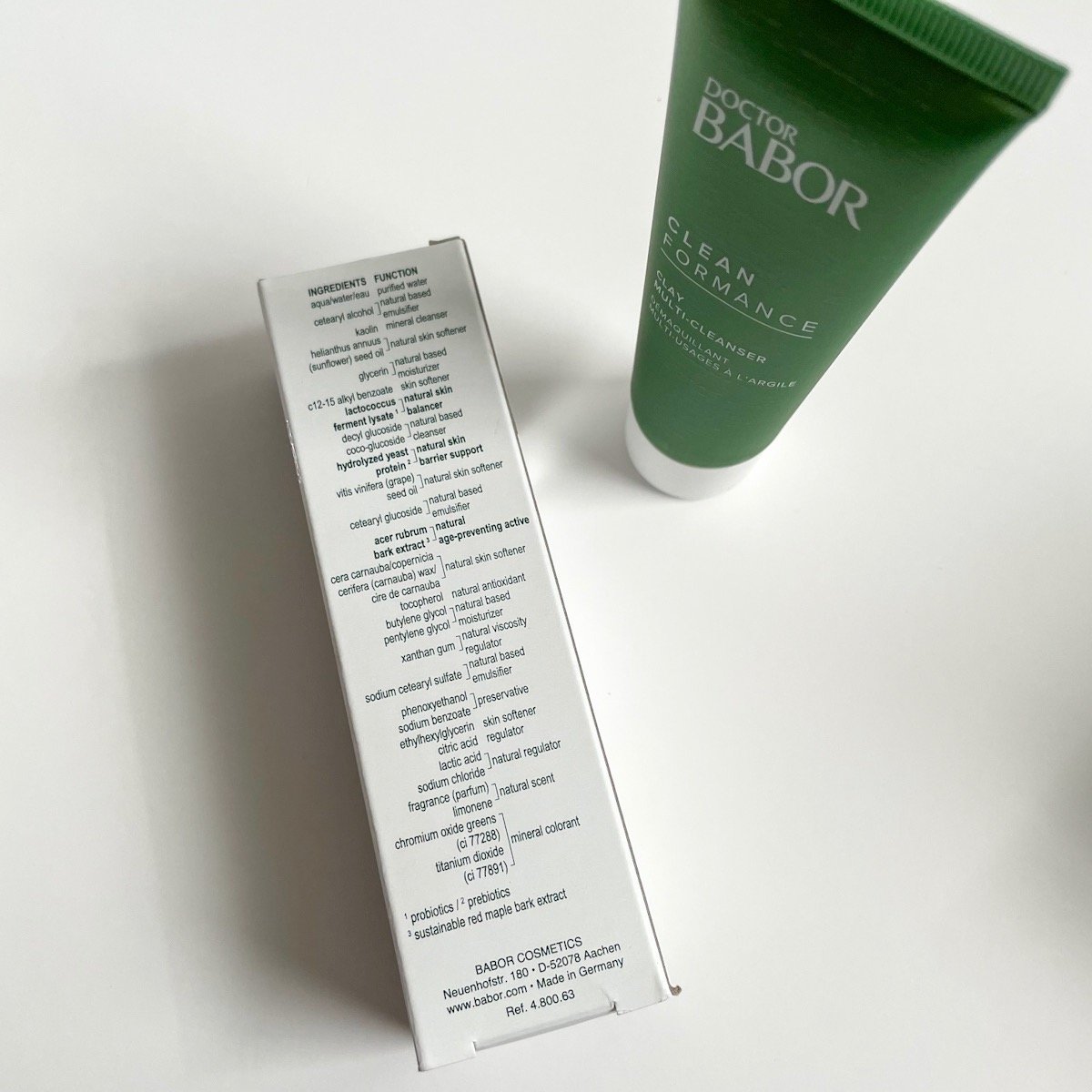 green tube next to alternate view of white box showing ingredients list