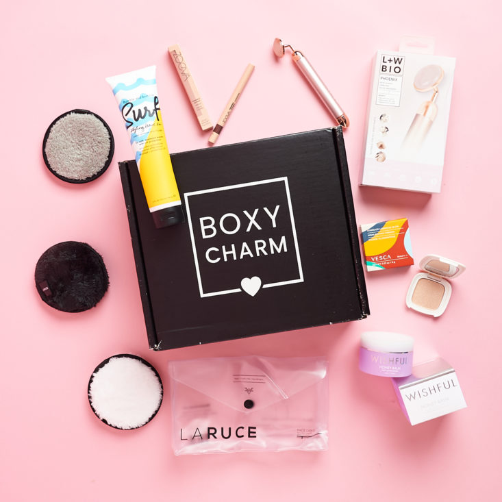 Boxycharm box with beauty items around it