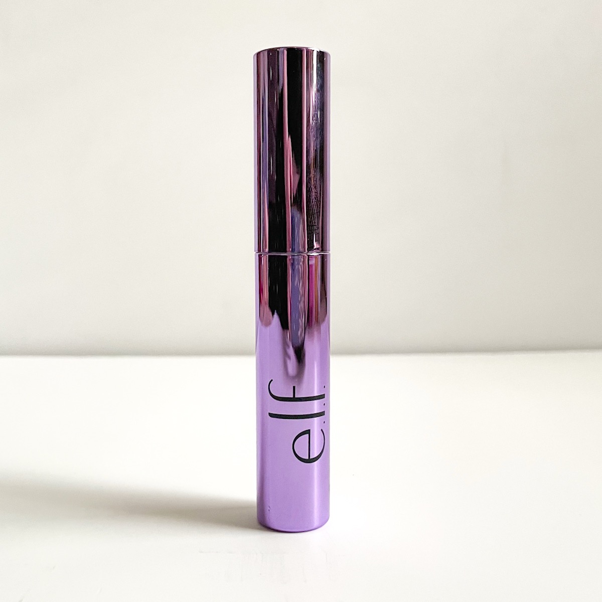 metallic purple mascara tube with e.l.f. label visible