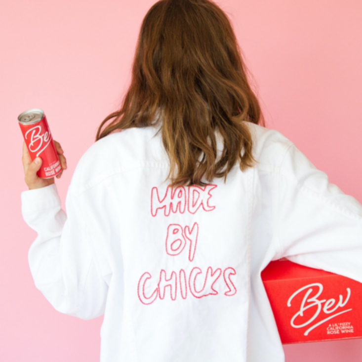 woman holding Bev canned wine