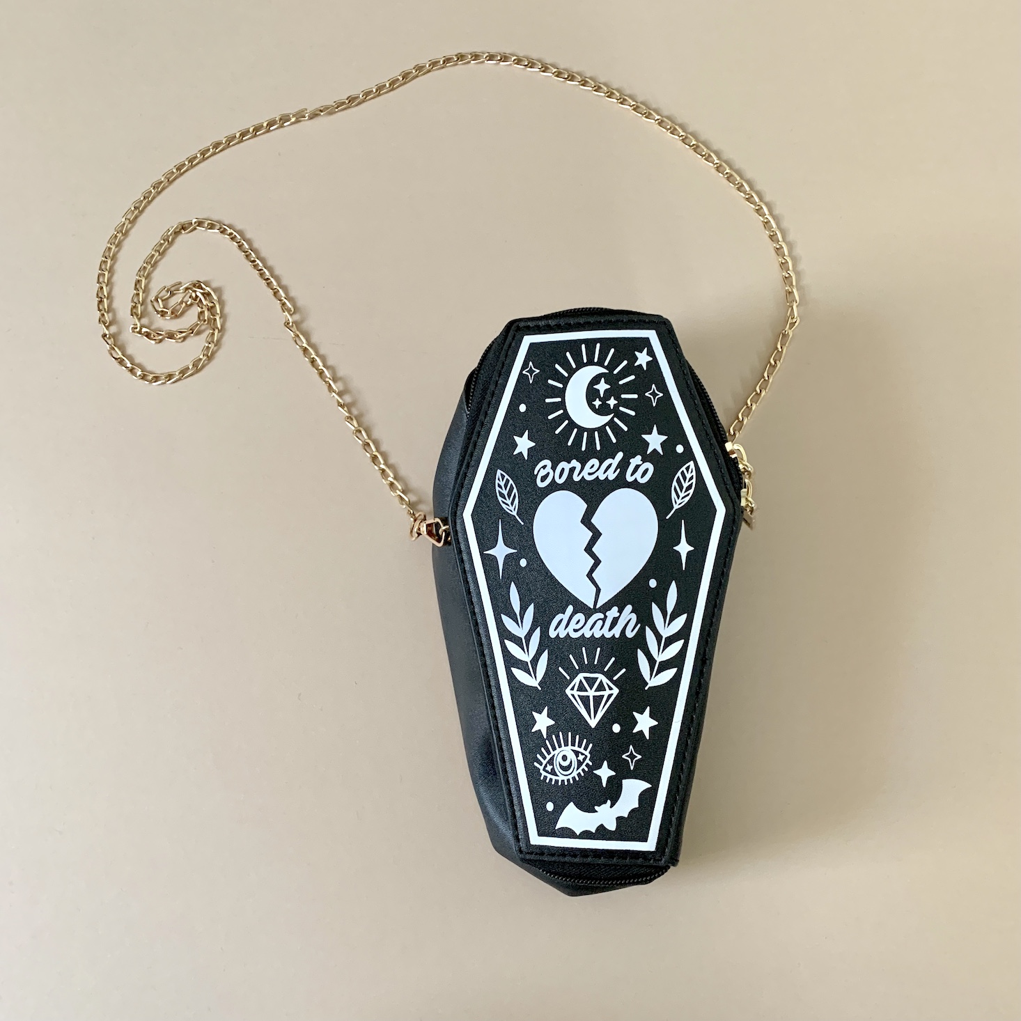 coffin shaped purse that said "bored to death"