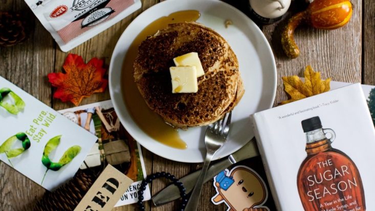photo of pancakes, book and other objects on a table