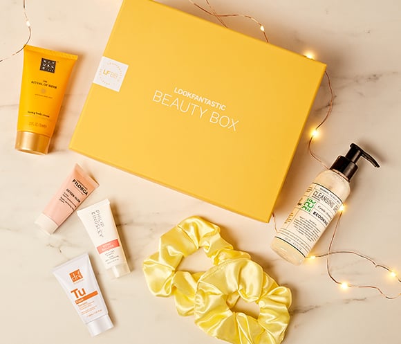 LookFantastic October box with yellow scrunchies and beauty products around it