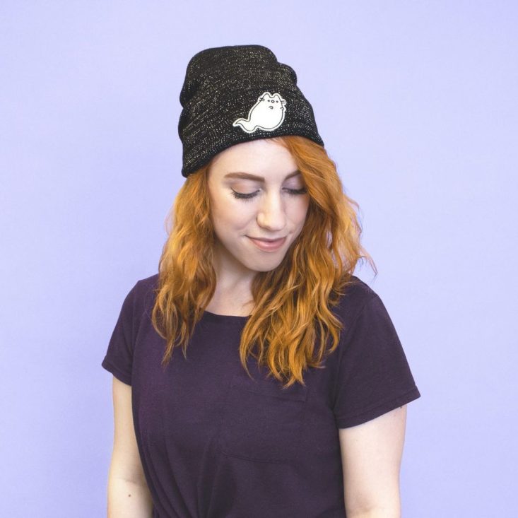 pusheen box hat worn by woman with red hair