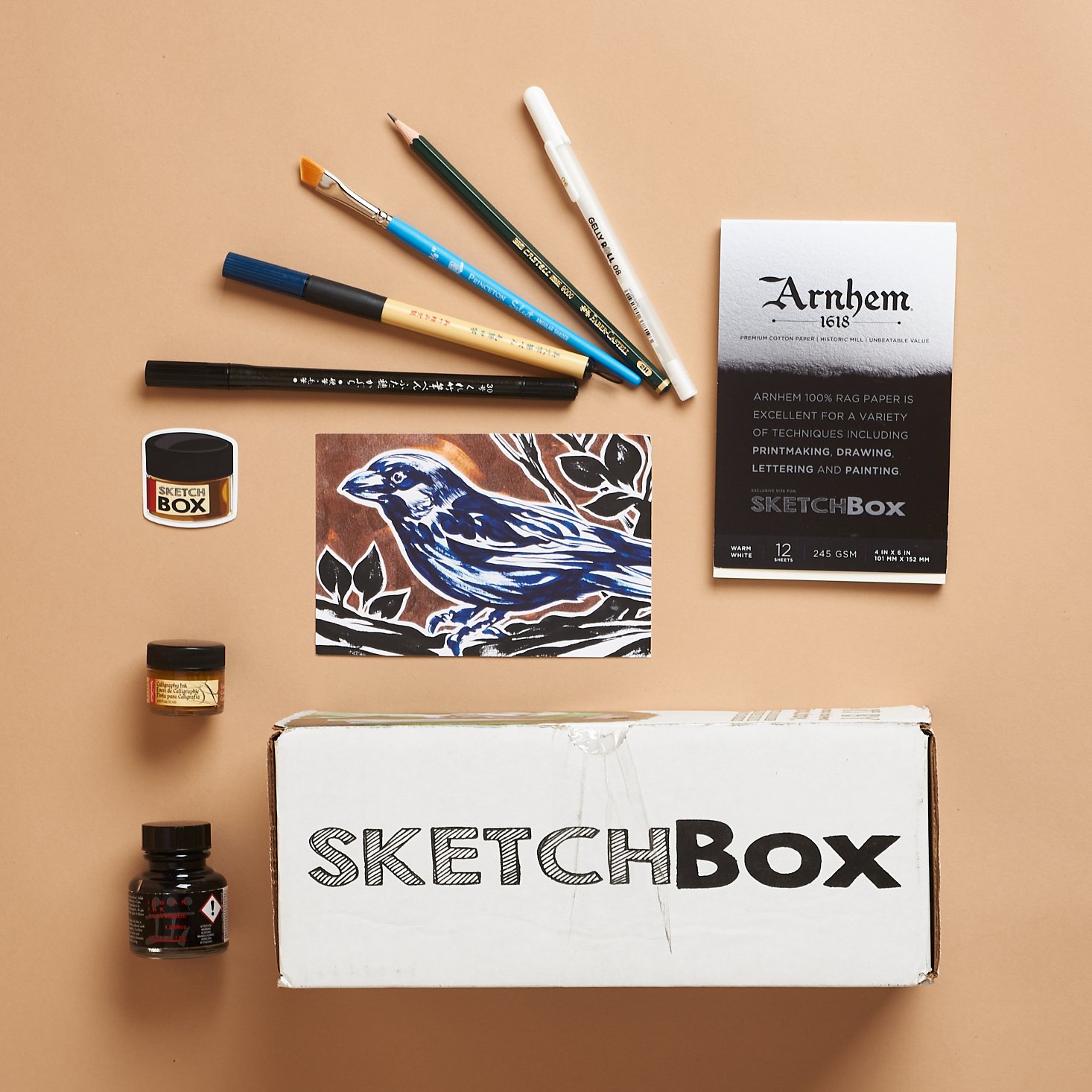sketchbox with artistic items around it