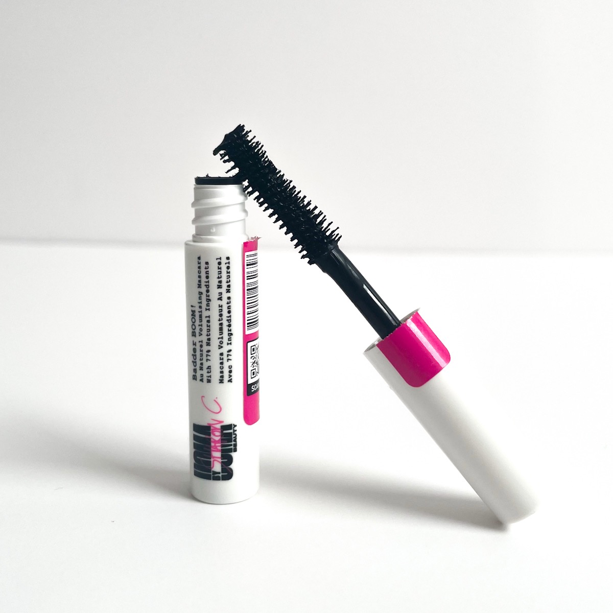 white tube of mascara opened to show fluffy brush wand