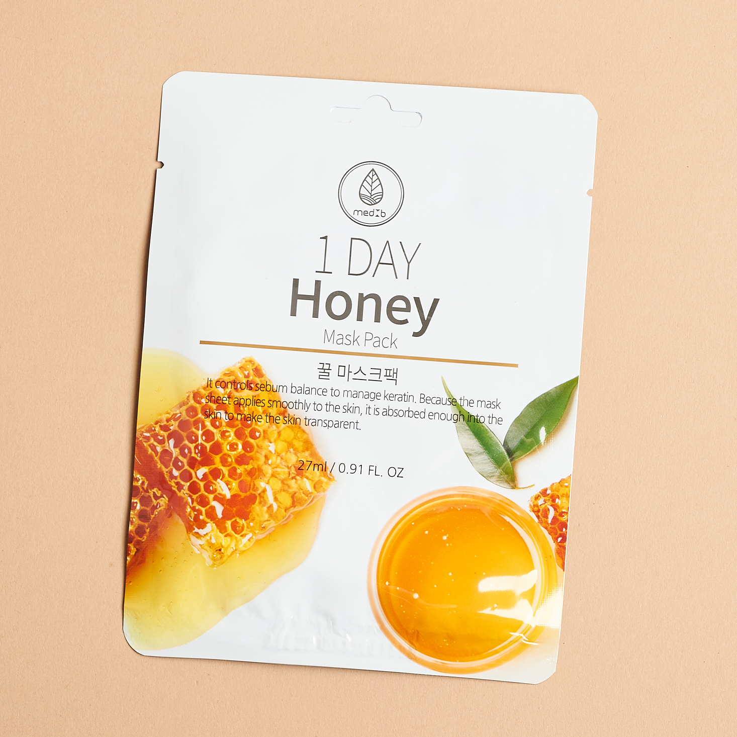 white sheet mask packaging showing honey comb