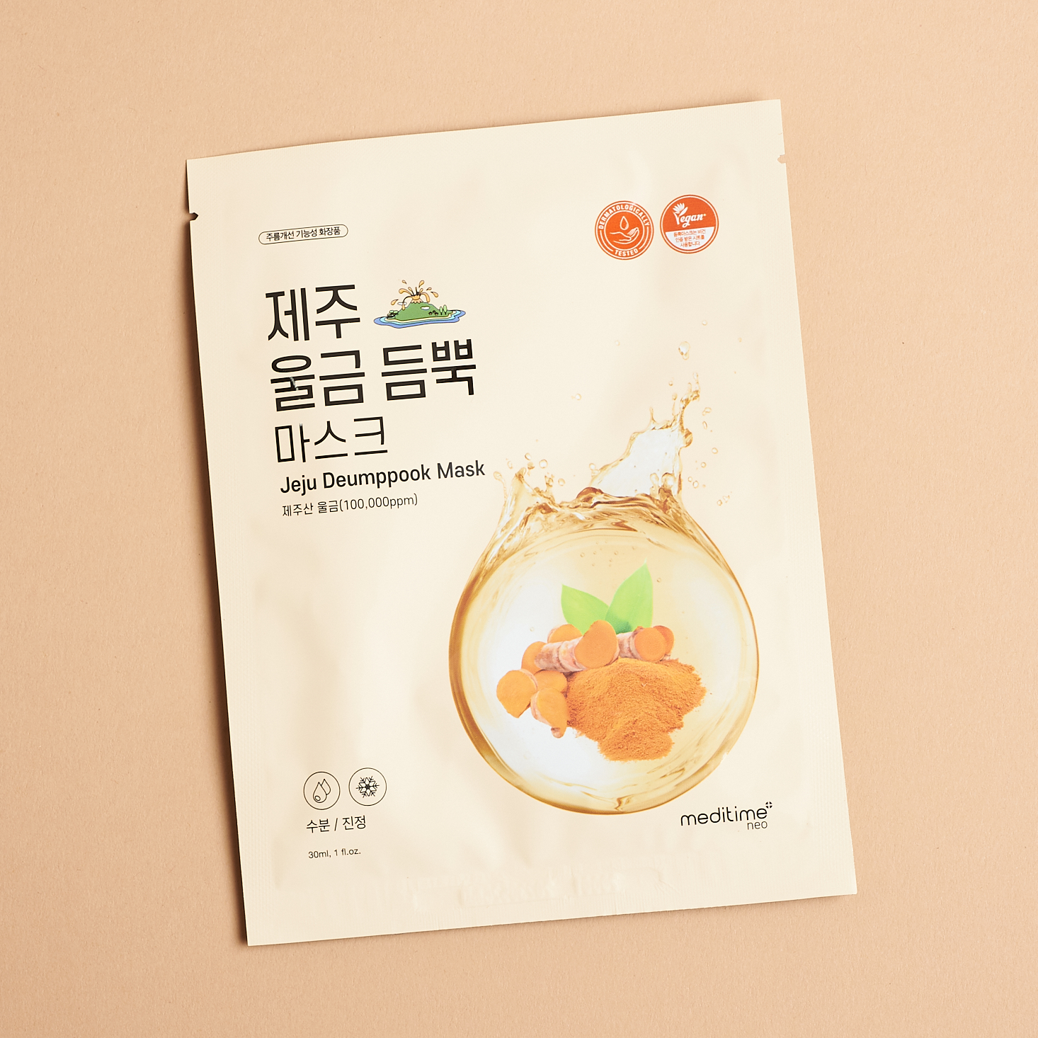 tan sheet mask with Korean characters prominently featured