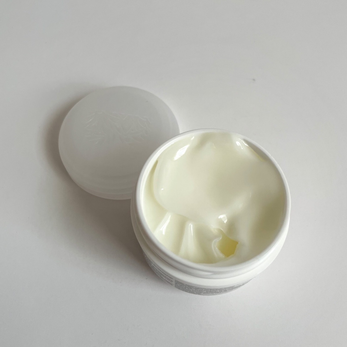 opened white jar showing white texture