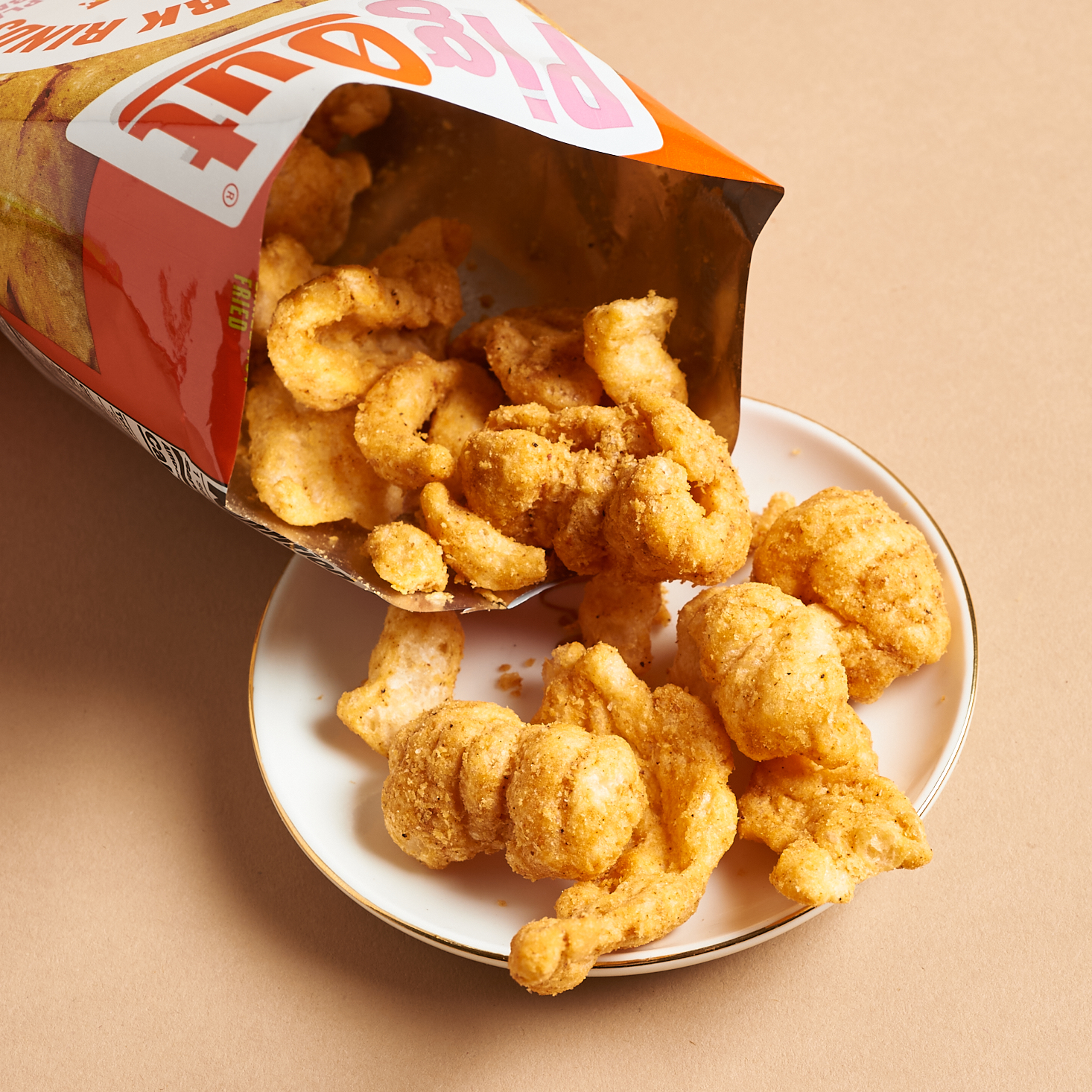 pigout pigless pork rinds package open with chips falling out