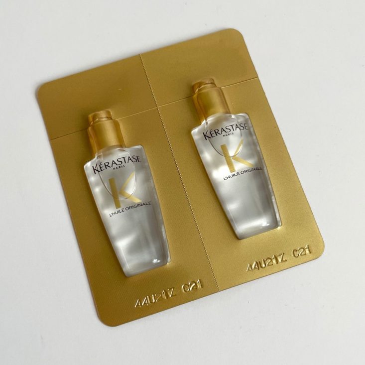 gold plastic packaging of clear hair serum