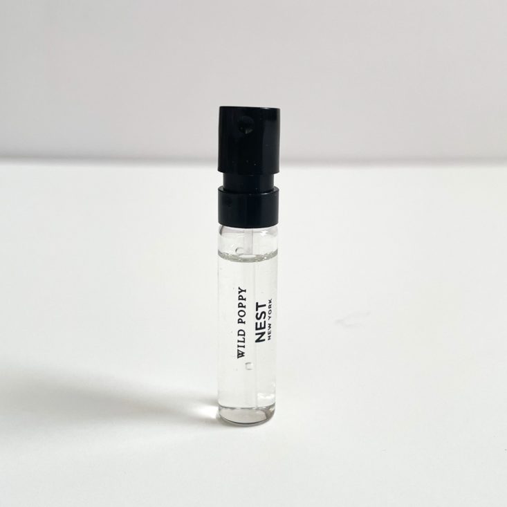clear perfume vial with black top